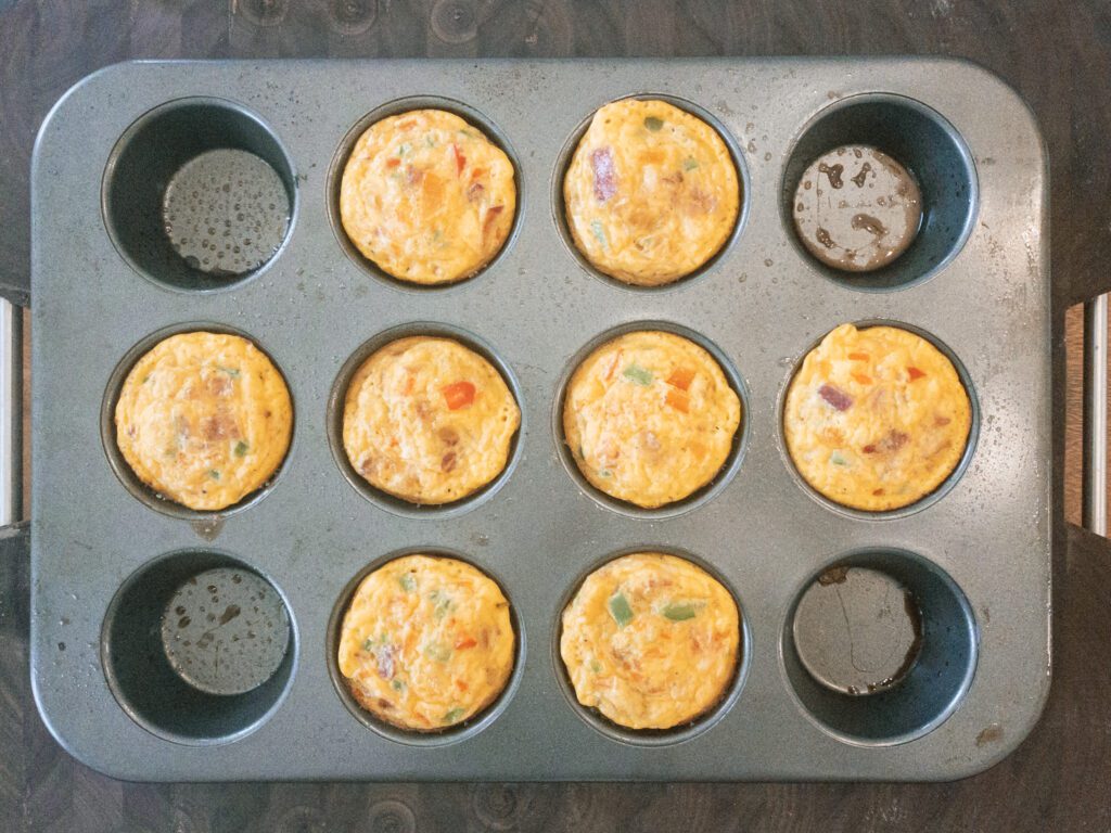 Healthy scrambled egg cups cooling in muffin tin