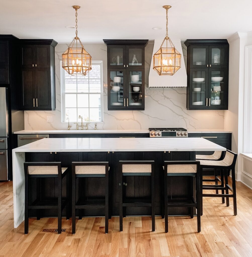 Modern Vintage Kitchen - Black cabinets brass fixtures