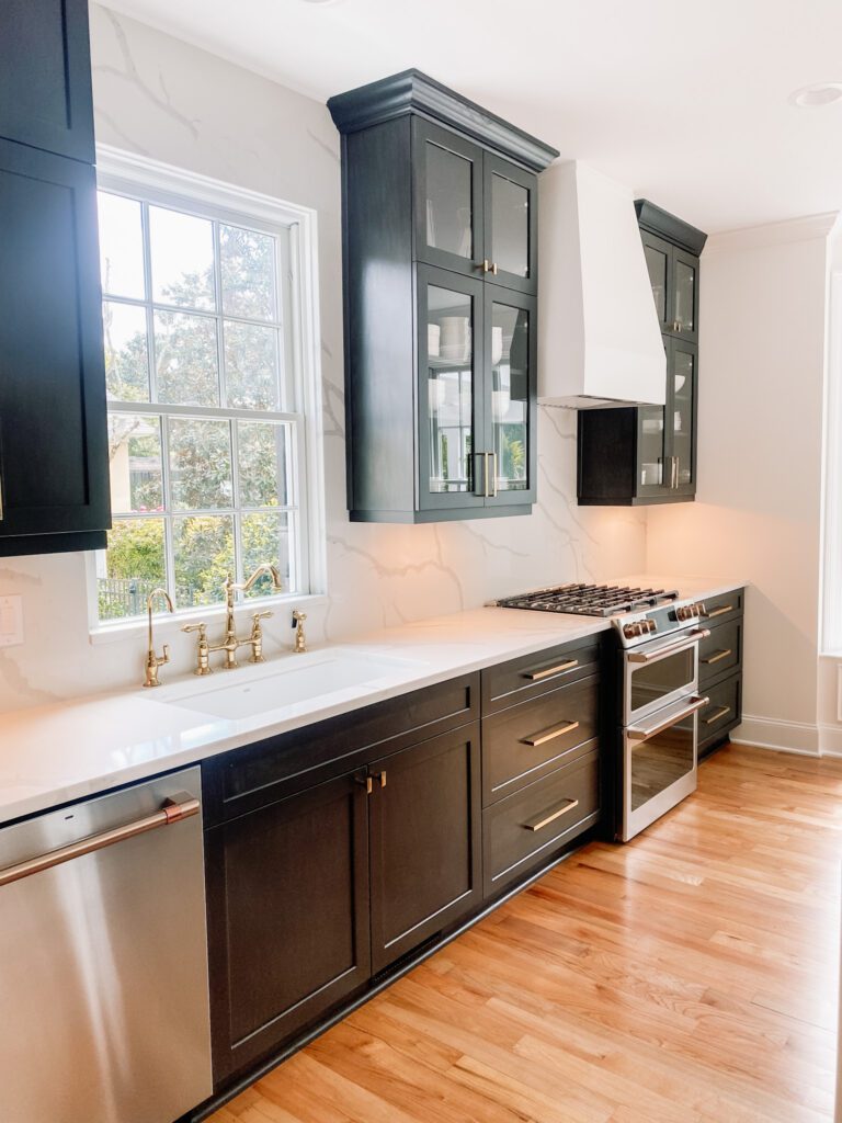 Modern Vintage Kitchen - Black cabinets white hood