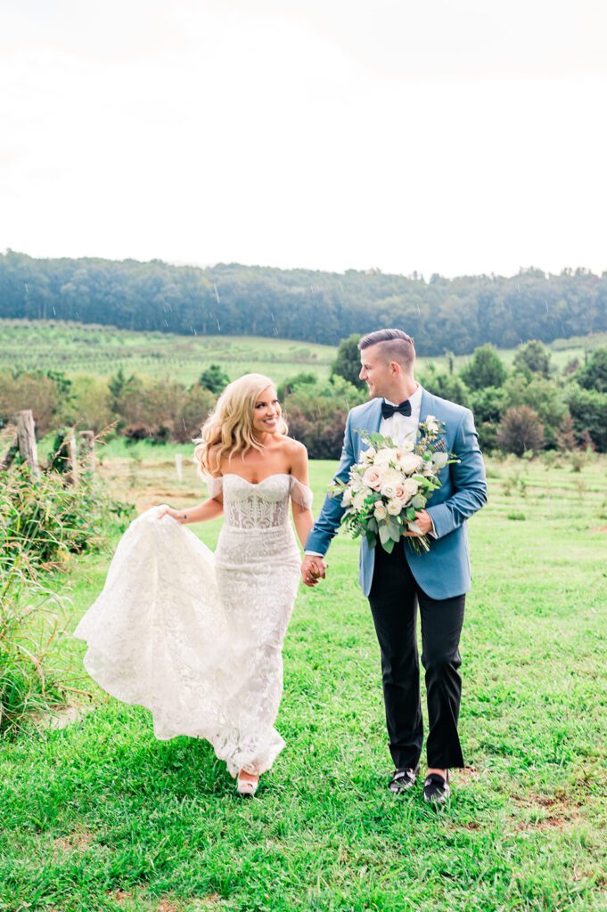 Bride and Groom walking in vineyard