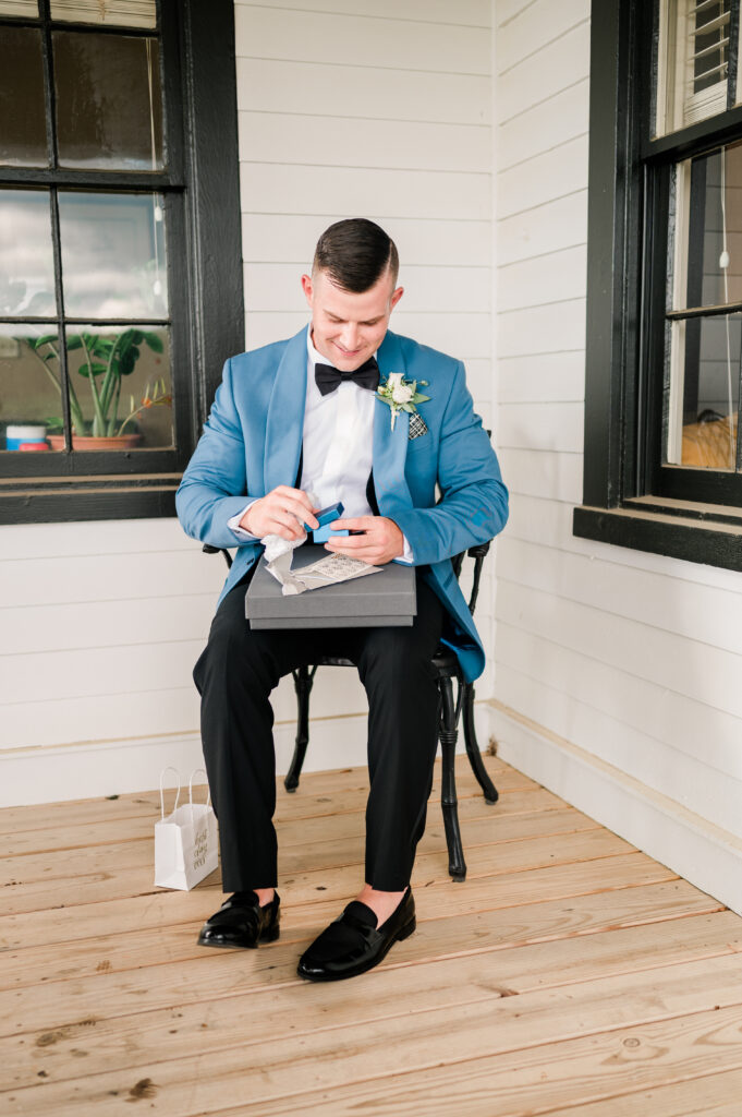 Groom opening gift from bride