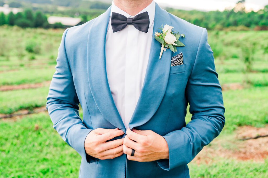 Baby blue tuxedo jacket with black bow tie