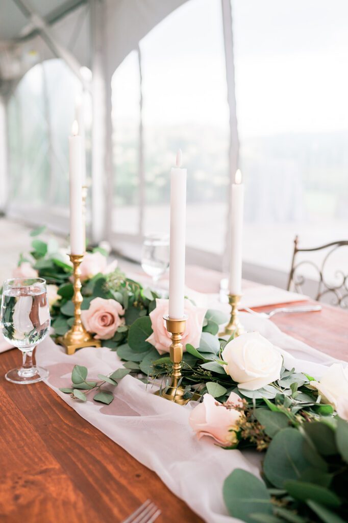 Romantic reception table decor - vintage candles, eucalyptus, and roses