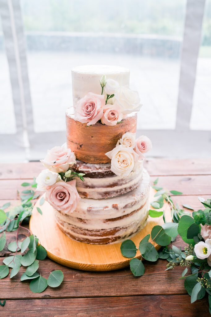 Rustic naked wedding cake with flowers