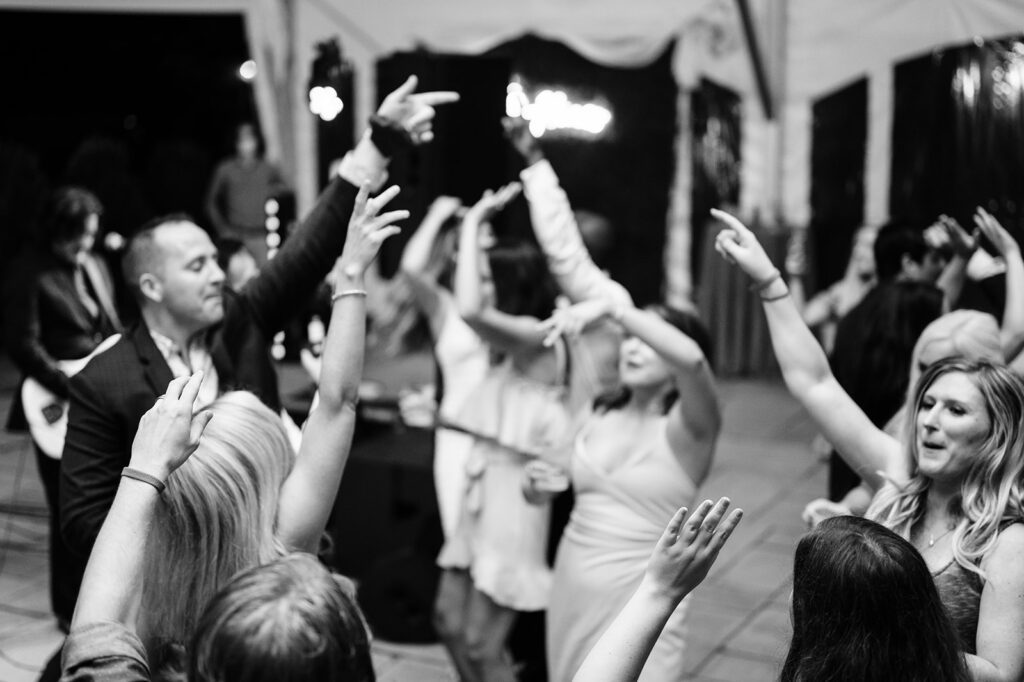 Wedding guests dancing at reception