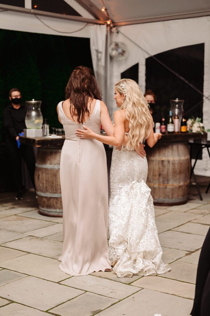 Sisters talking at wedding reception