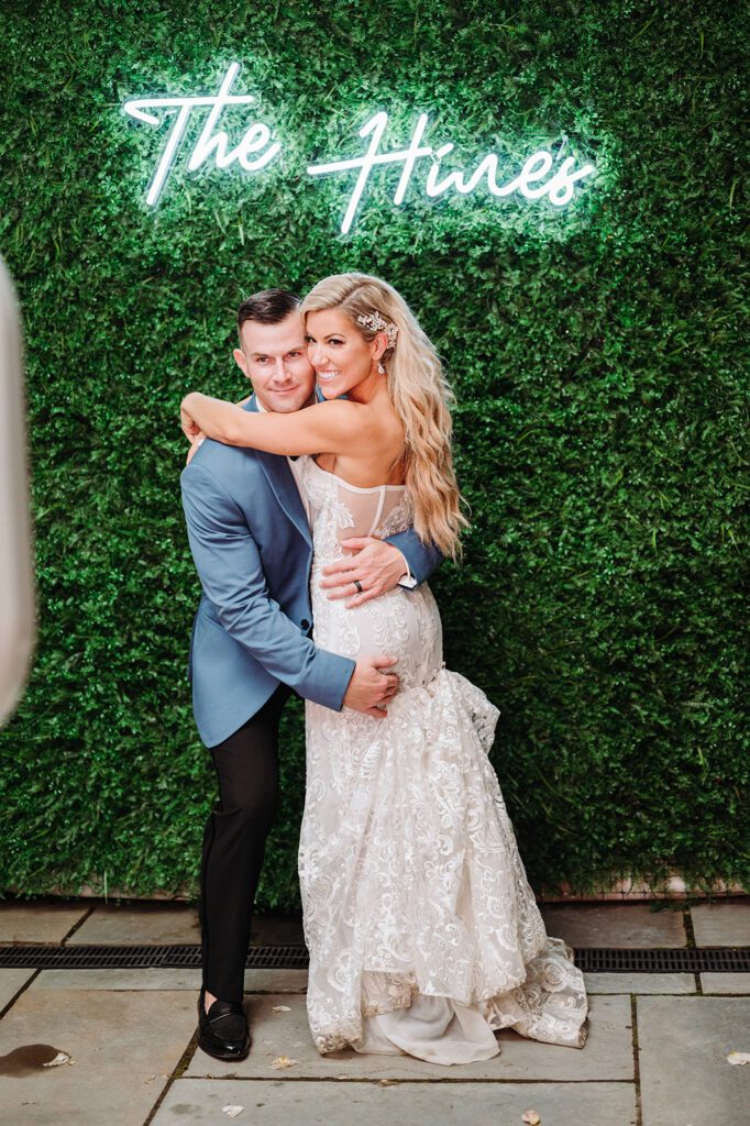 Bride and groom in front of photo booth