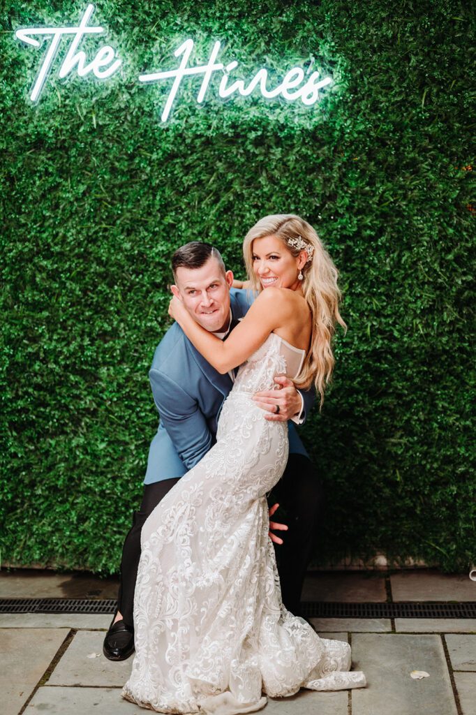 Bride and groom in front of photo booth