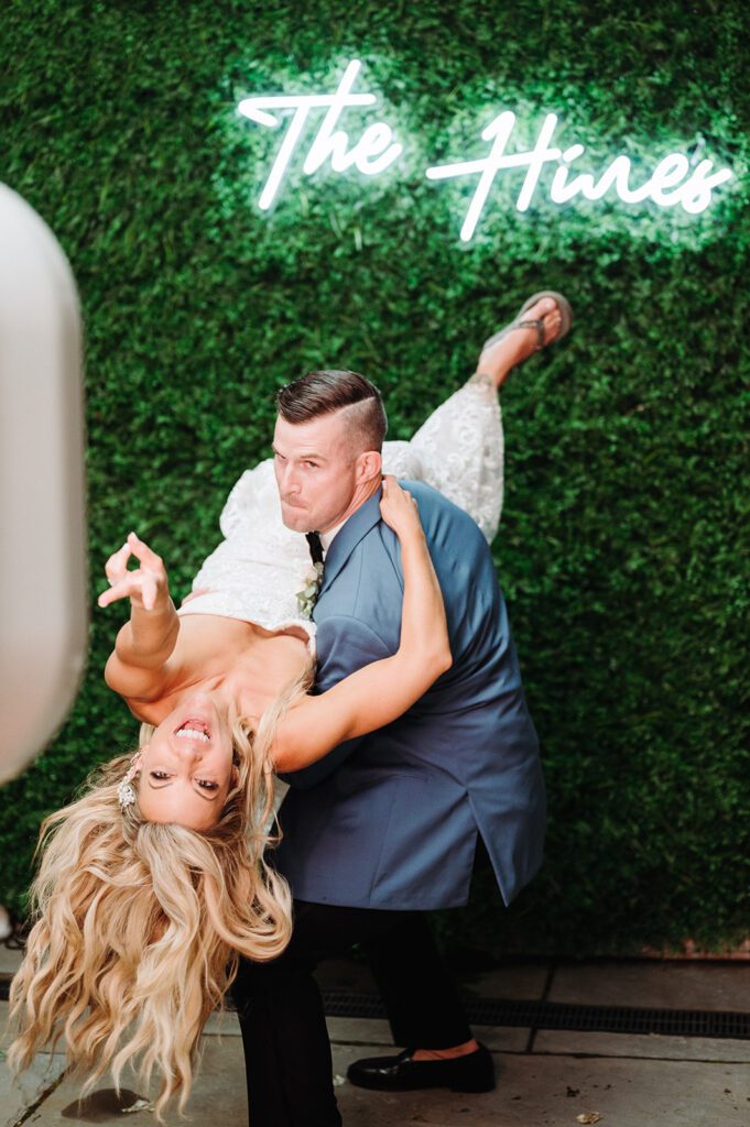 Bride and groom in front of photo booth