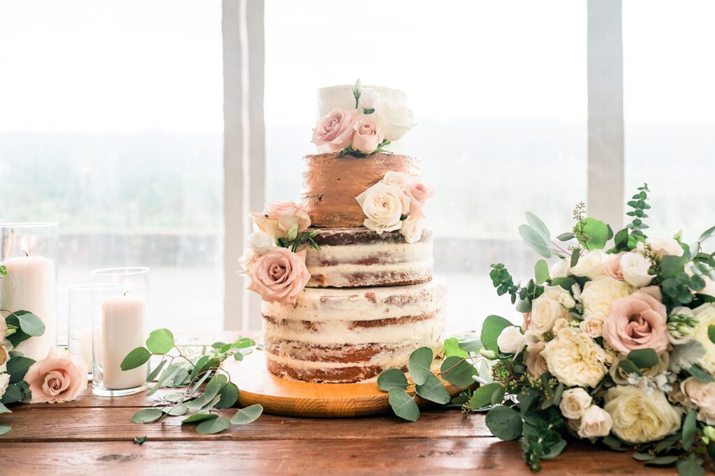 Rustic wedding cake with flowers at Vineyard wedding