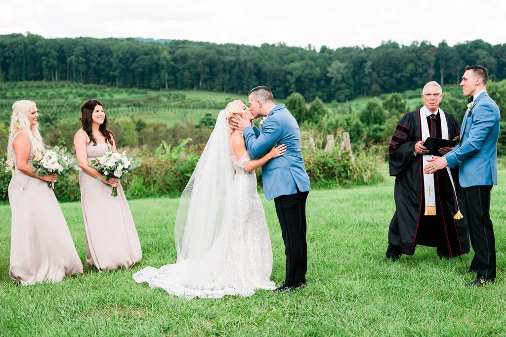 Bride and Groom kissing at wedding alter