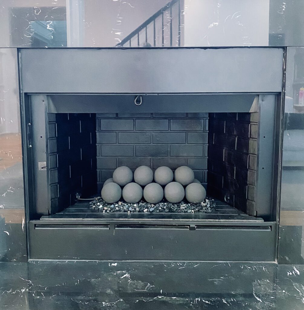 Painted Fireplace box with Modern Gas Fire Balls and Fire Glass