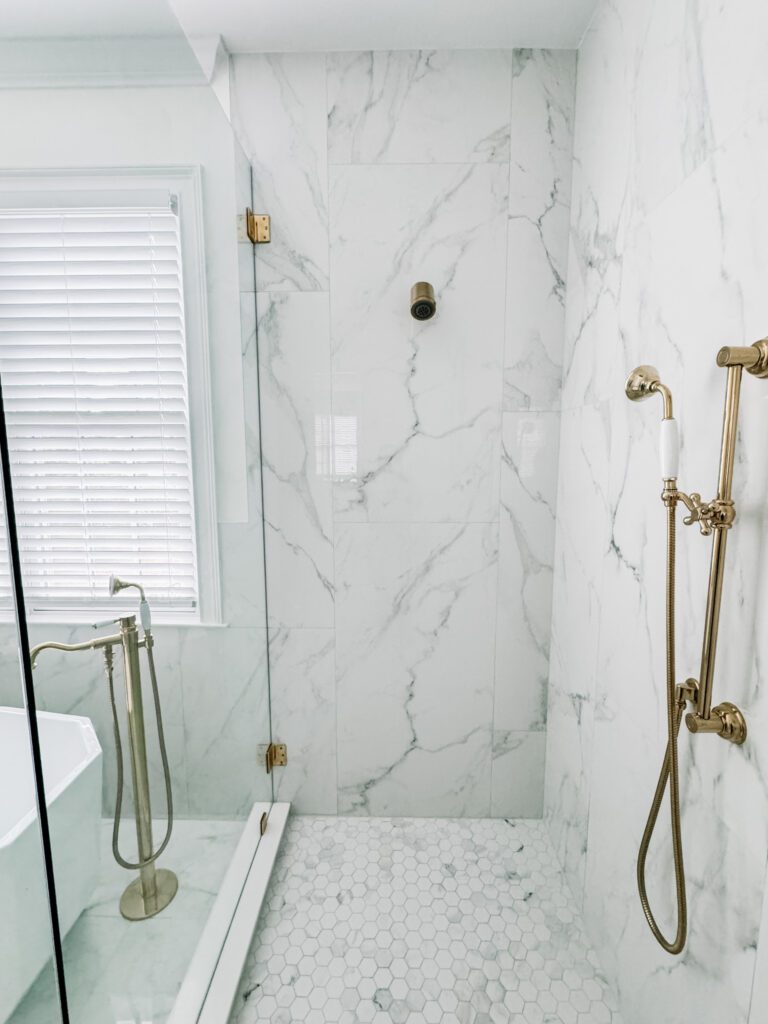Modern Glam Luxury Bathroom Shower, Porcelain Tile and Polished Brass Shower Fixtures, Vintage Hand Shower