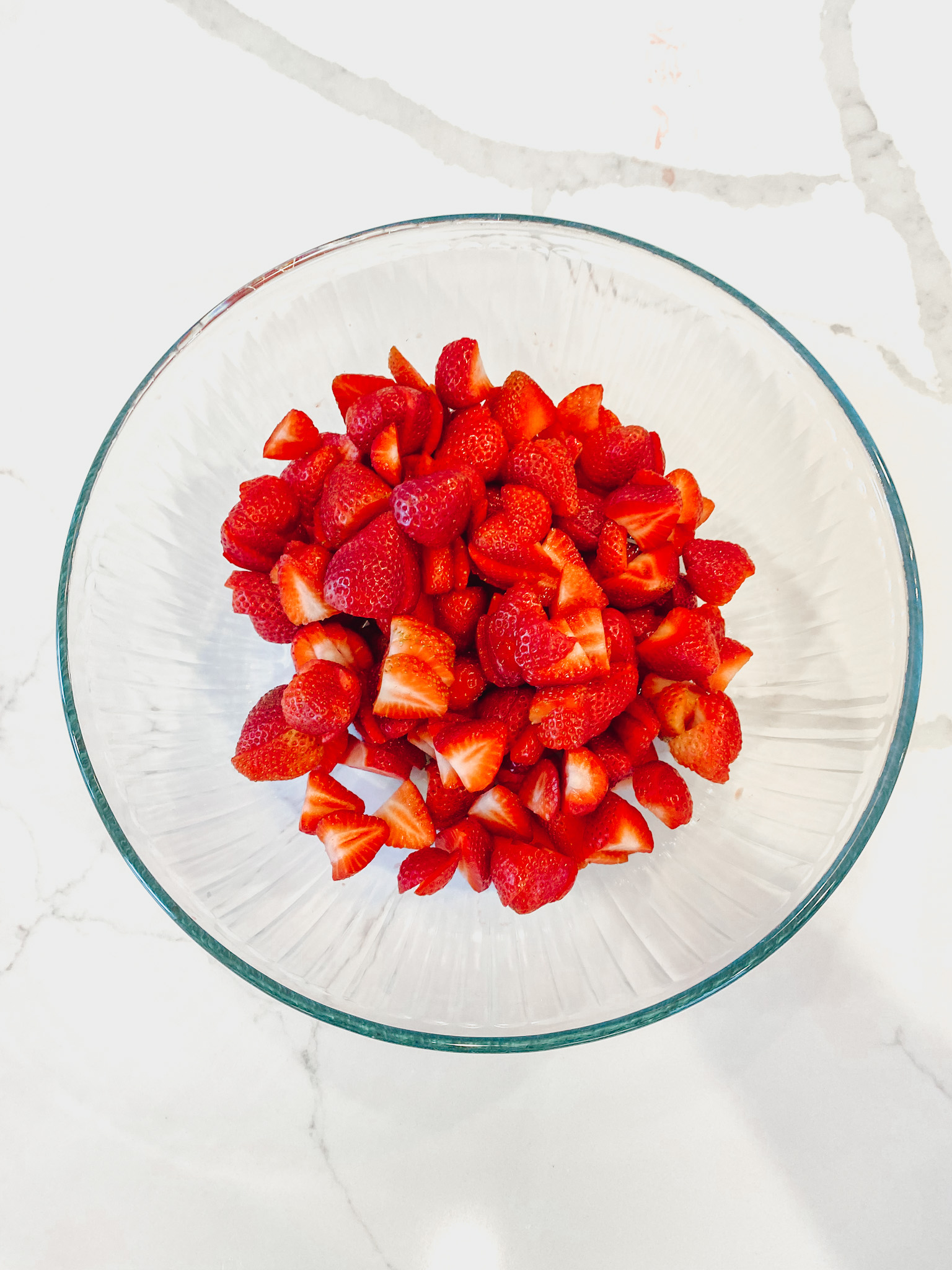 Sliced strawberries in bowl