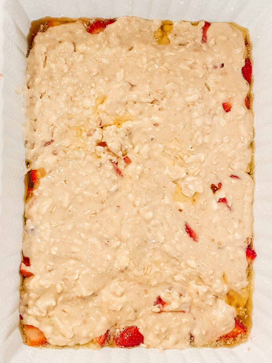 Uncooked batter on top strawberry cobbler