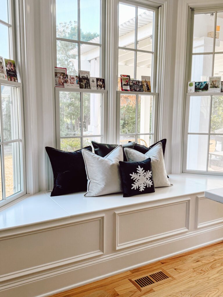 Christmas Cards in Bay window with Christmas throw pillow
