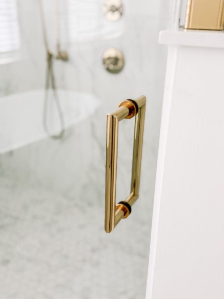Modern Glam Luxury Bathroom Shower, Large Format Porcelain Tile and Polished Brass Shower Door Handle