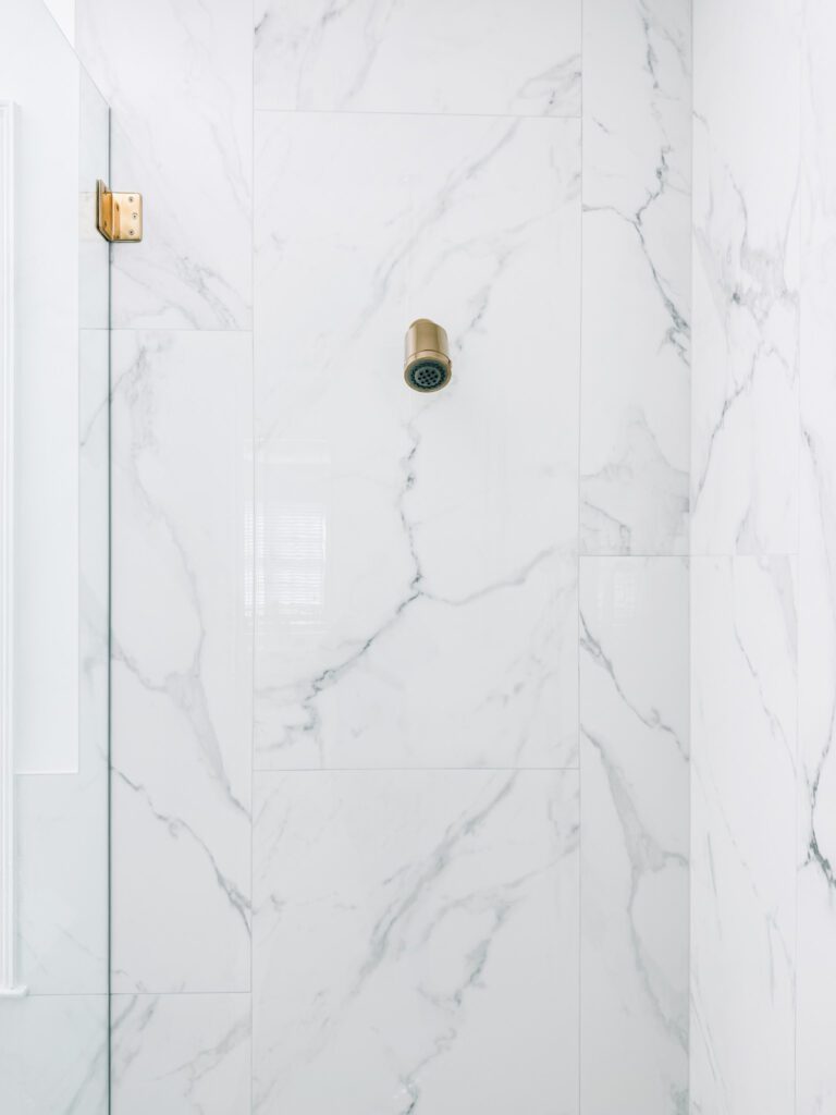 Modern Glam Luxury Bathroom Shower, Large Format Porcelain Tile and Polished Shower Head